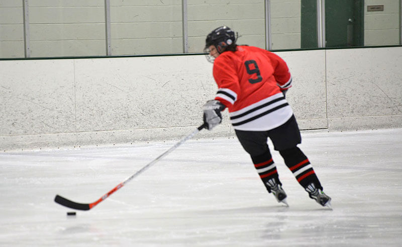 Image of Michelle playing ice hockey